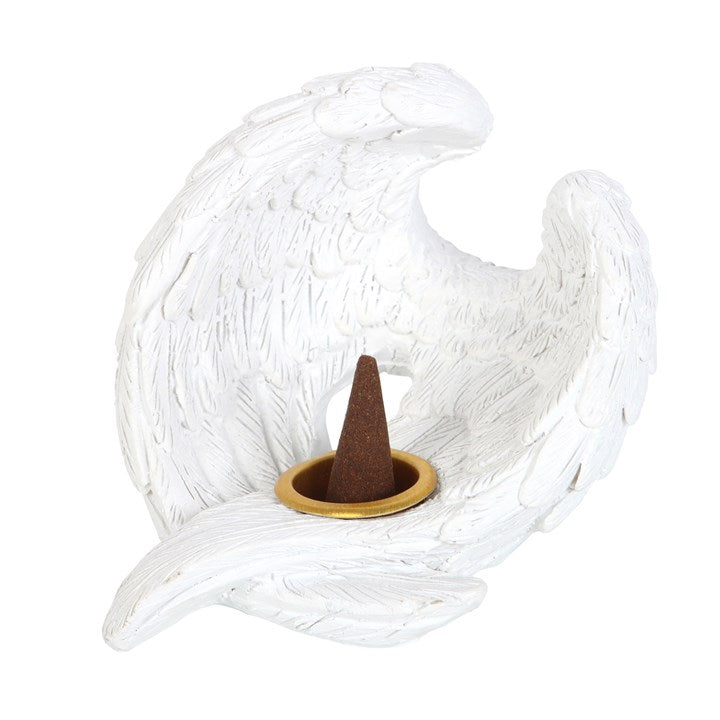 Decorative incense holder shaped like a white leaf with a brown cone on a white background