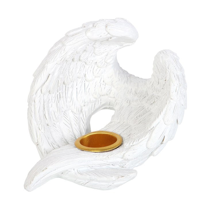 Decorative white candle holder with gold base on a white background