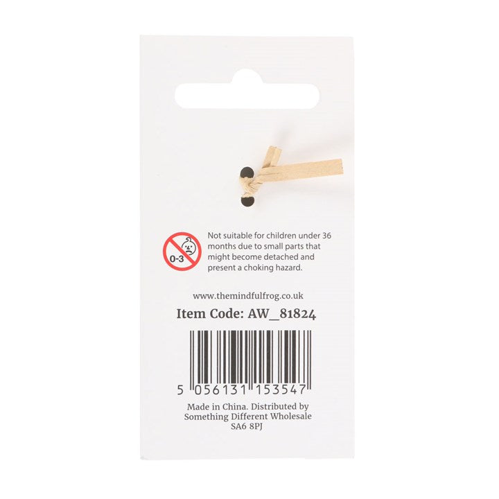 Wooden toy peg with black bead on a white card with product details.
