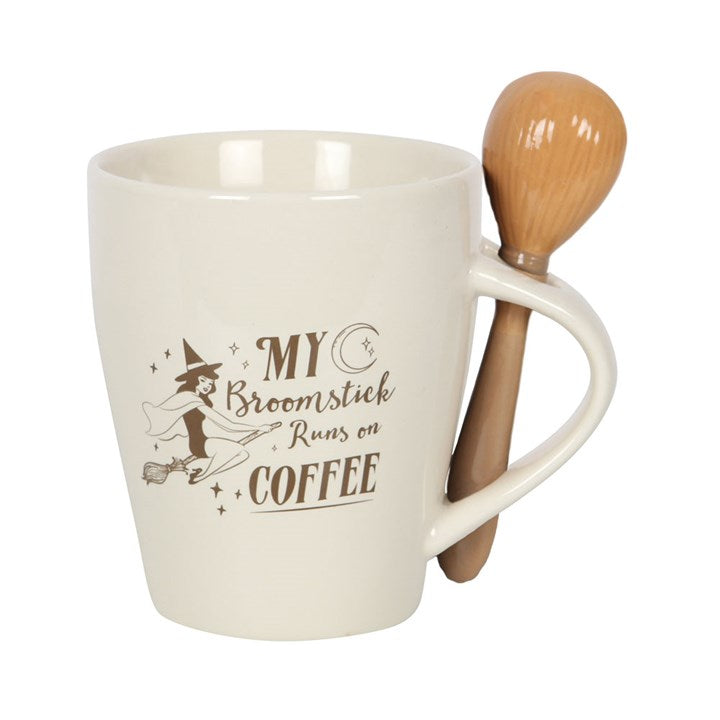 White mug with wooden spoon featuring a humorous coffee-themed design on a white background