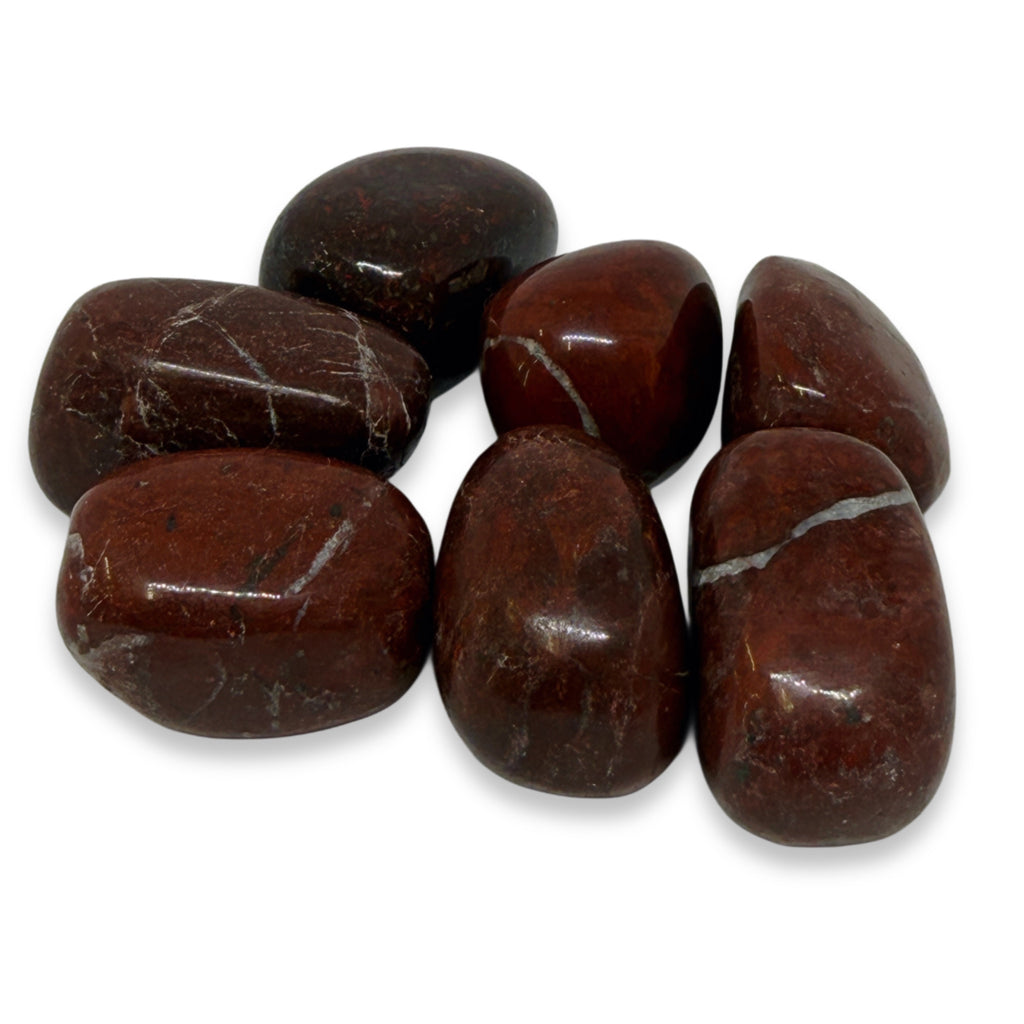 Brown stones with visible veins on a white background