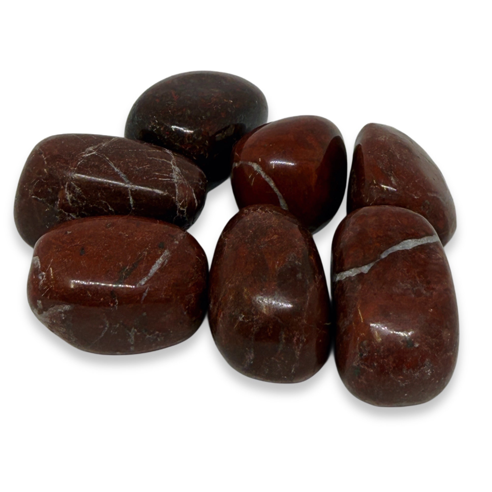 Brown stones with visible veins on a white background