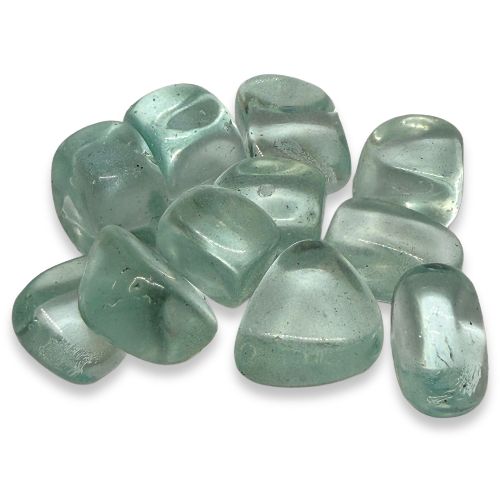 Green tumbled stones on a white background