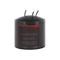 Black pillar candle with 'Vampire Tears' text and red design on a white background