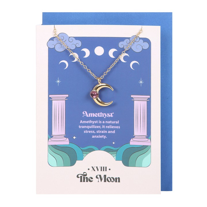 Necklace with moon charm on a decorative card with moon phases and columns.