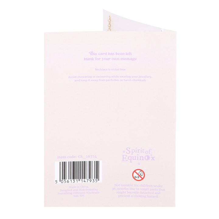 Back of a product packaging with text and a barcode on a light pink background