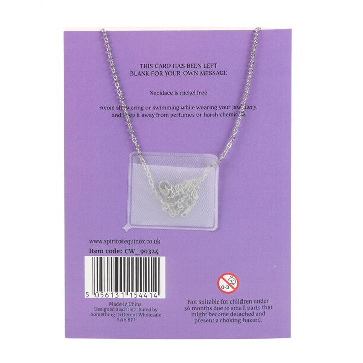 Necklace on a purple card with product details