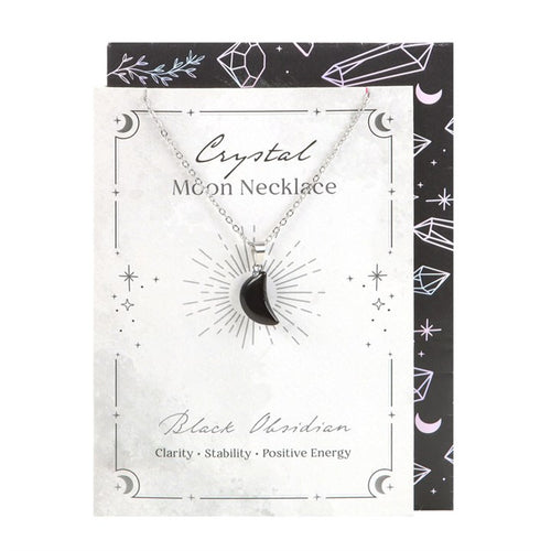 Crystal moon necklace on a decorative card with black and white design