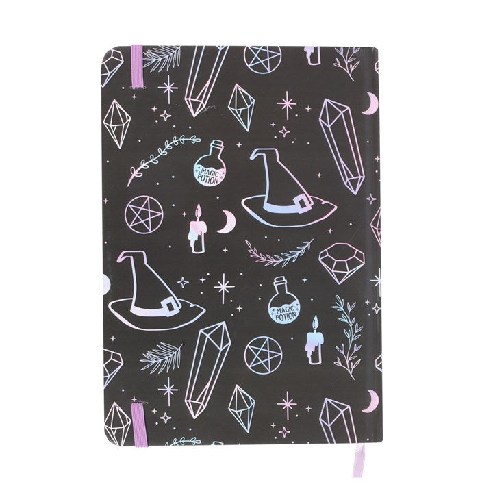 Notebook with witch hat, crystal, and potion design on a black background