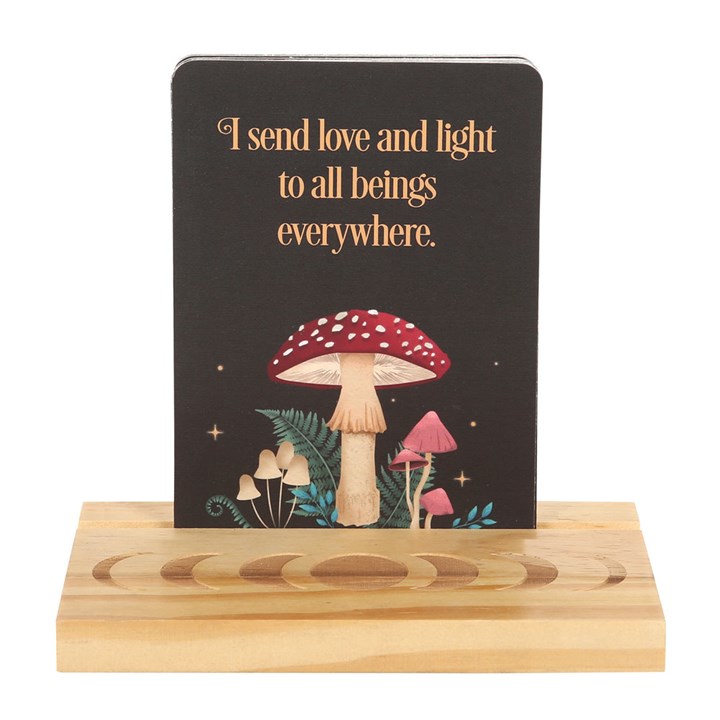 Decorative stand with a black card featuring mushrooms and text on a white background