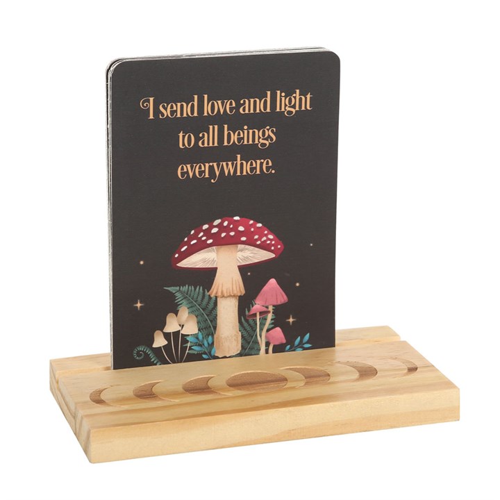 Decorative stand with a card featuring mushrooms and text on a white background