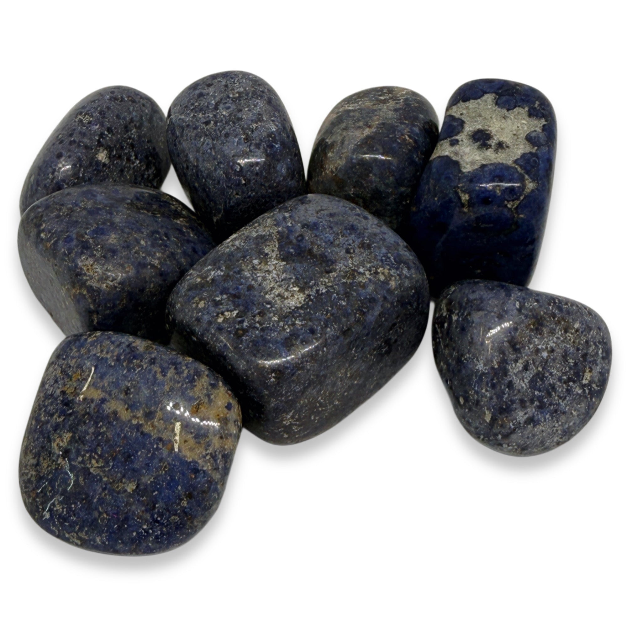 Collection of dark blue stones on a white background