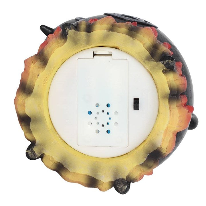 Round night light with colorful shell-like design on a white background