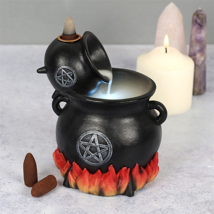 Black cauldron-shaped incense burner with flame design, featuring a pentagram symbol, on a light gray surface.