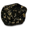 Black stone with white and beige speckles on a white background