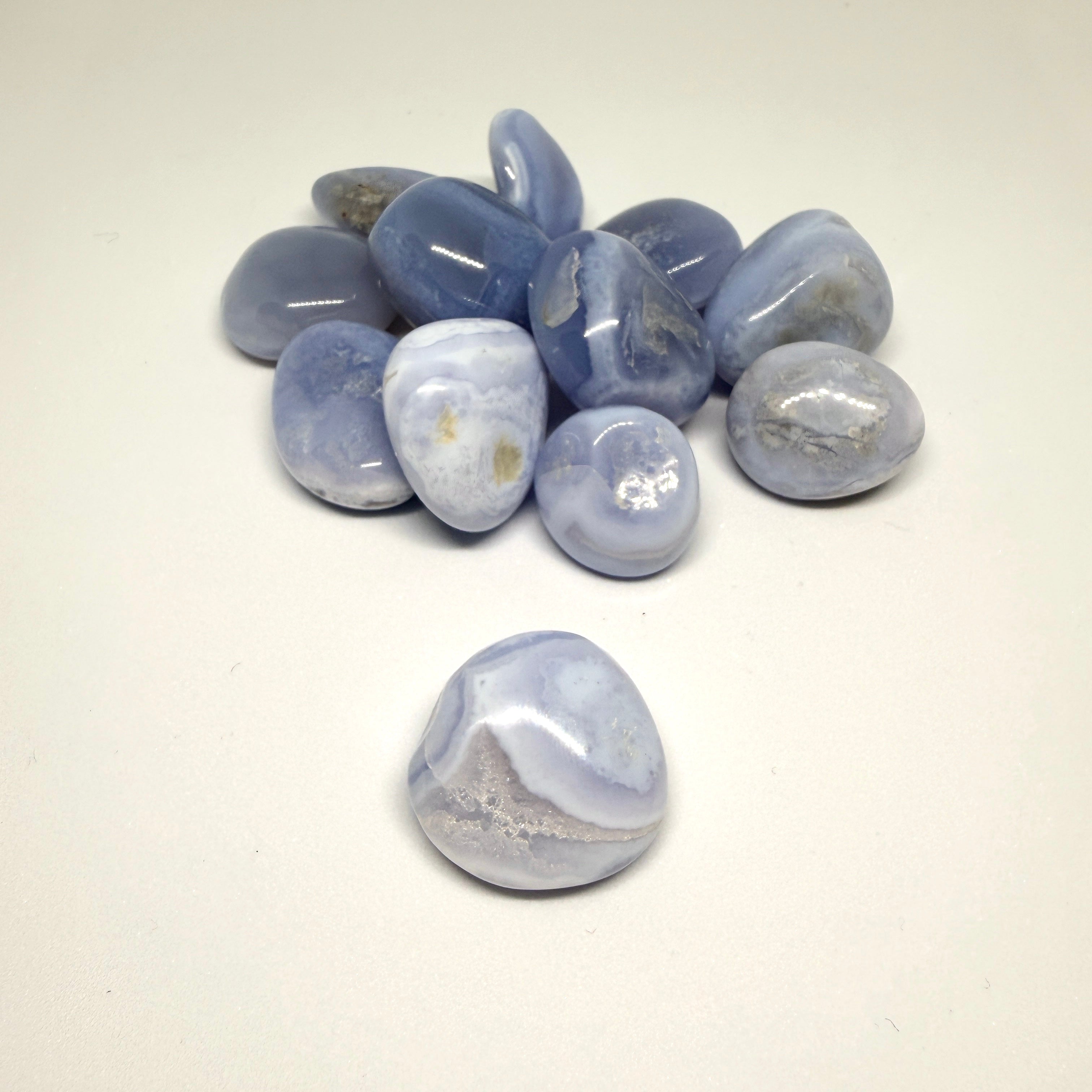 Blue and white marbled stones on a light gray background