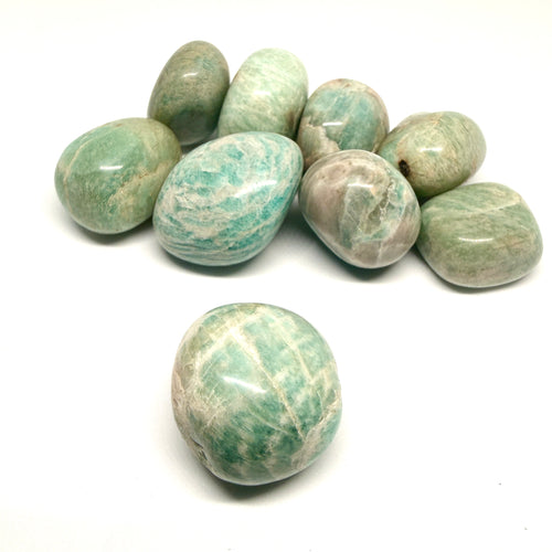 Green and white marbled stones on a white background