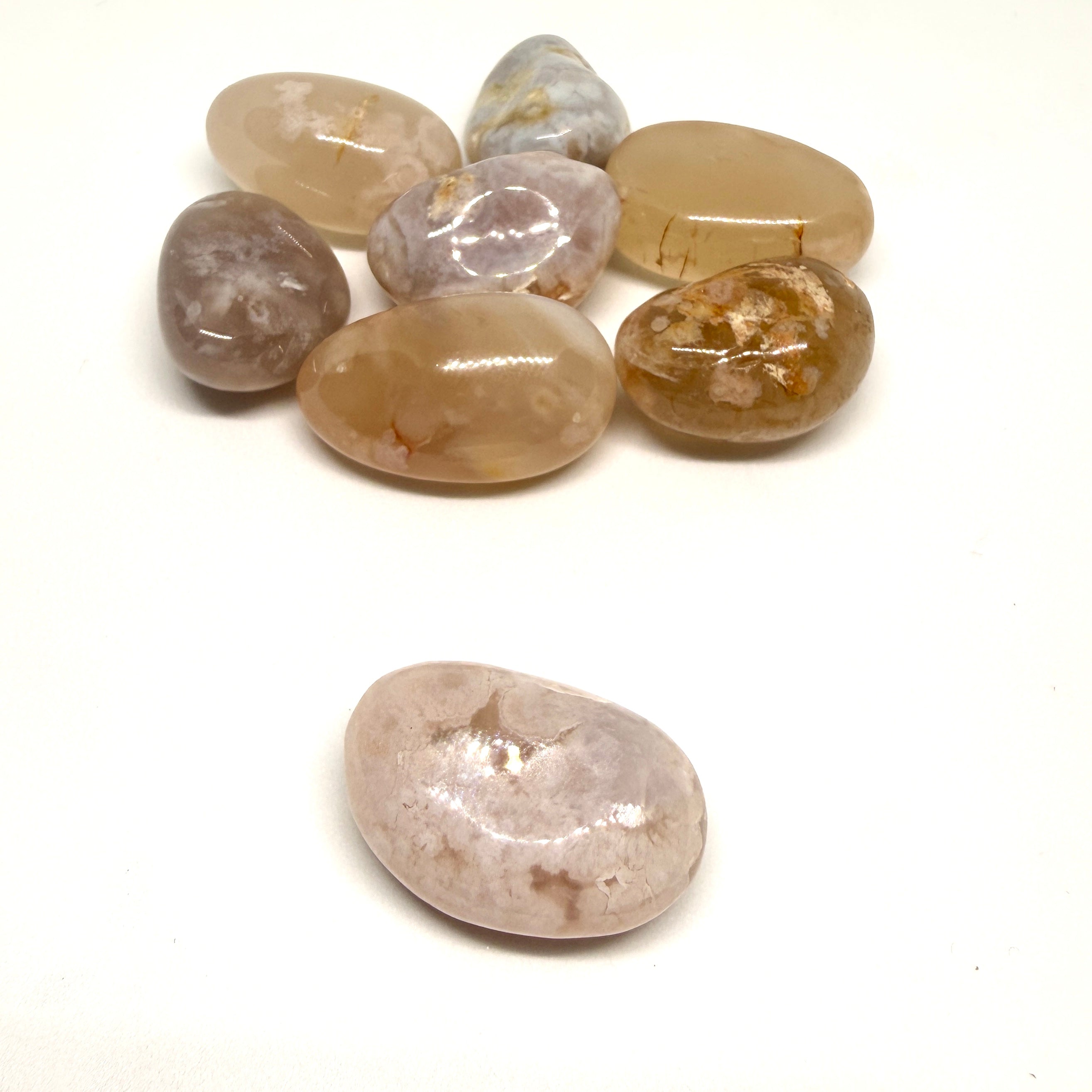 Collection of polished stones on a white background