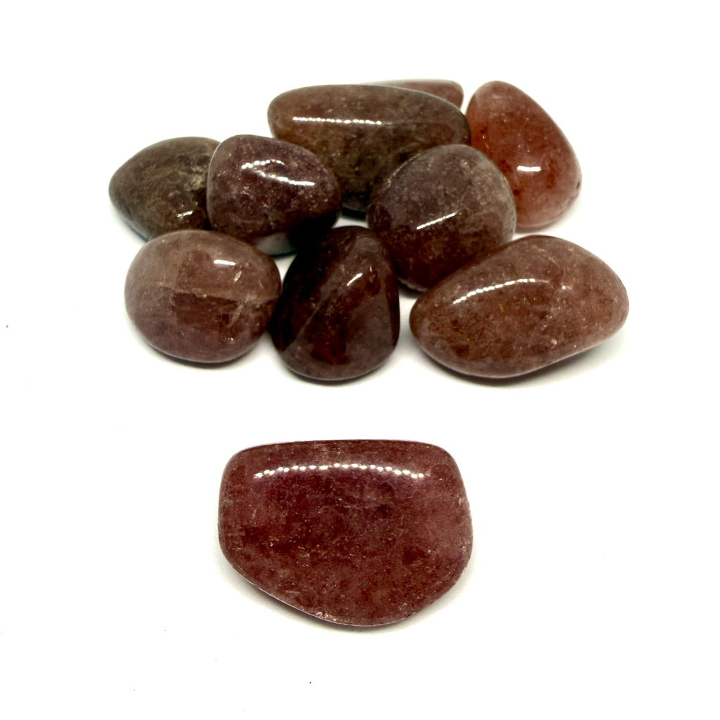 Brown polished stones on a white background
