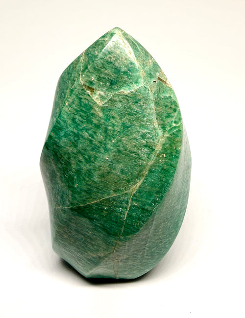 Green crystal on a white background