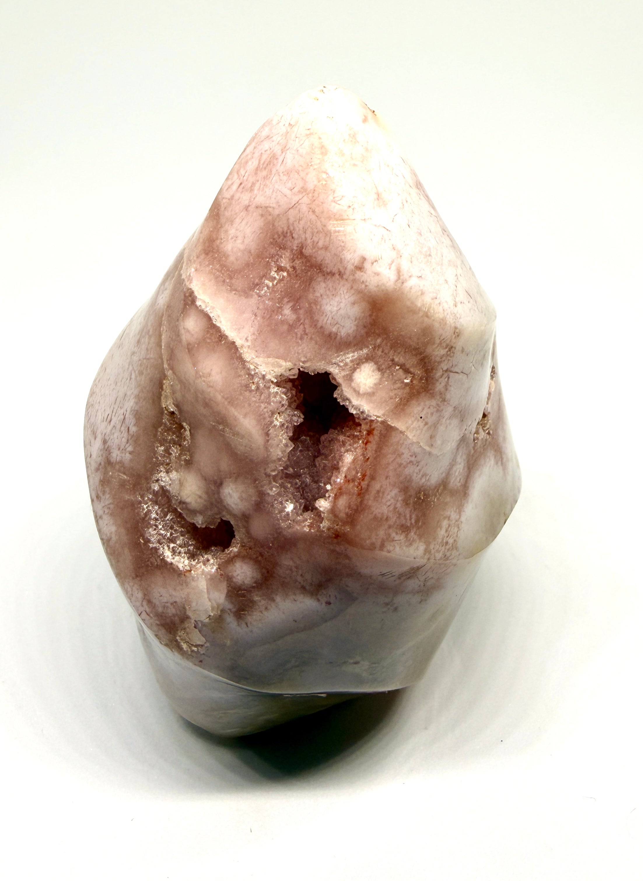 Unpolished stone with a rough texture on a white background