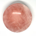 Round pink stone on a white background