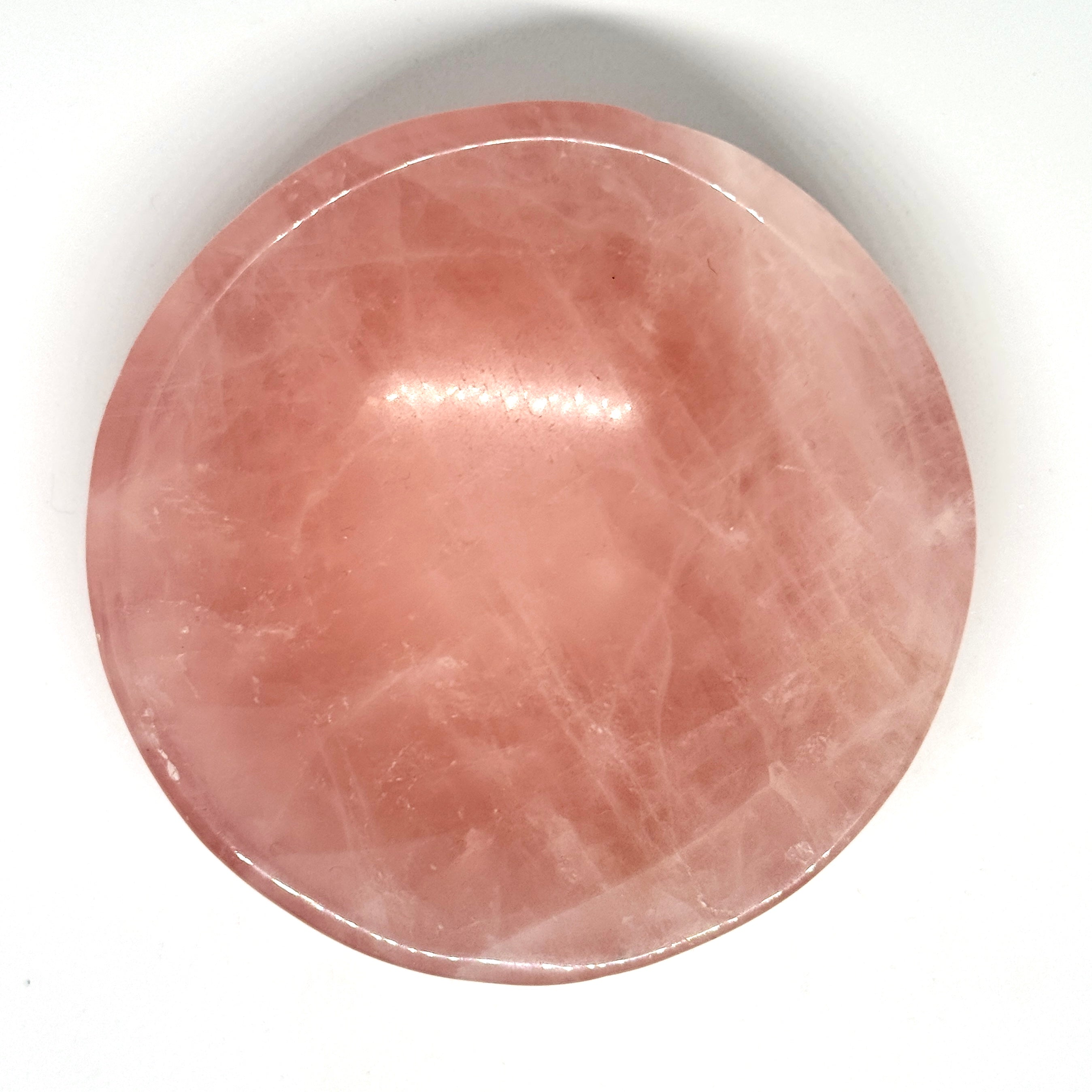 Round pink stone on a white background