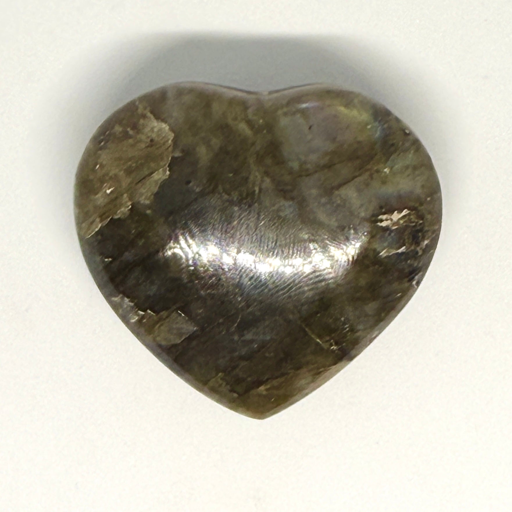 Heart-shaped stone on a white background