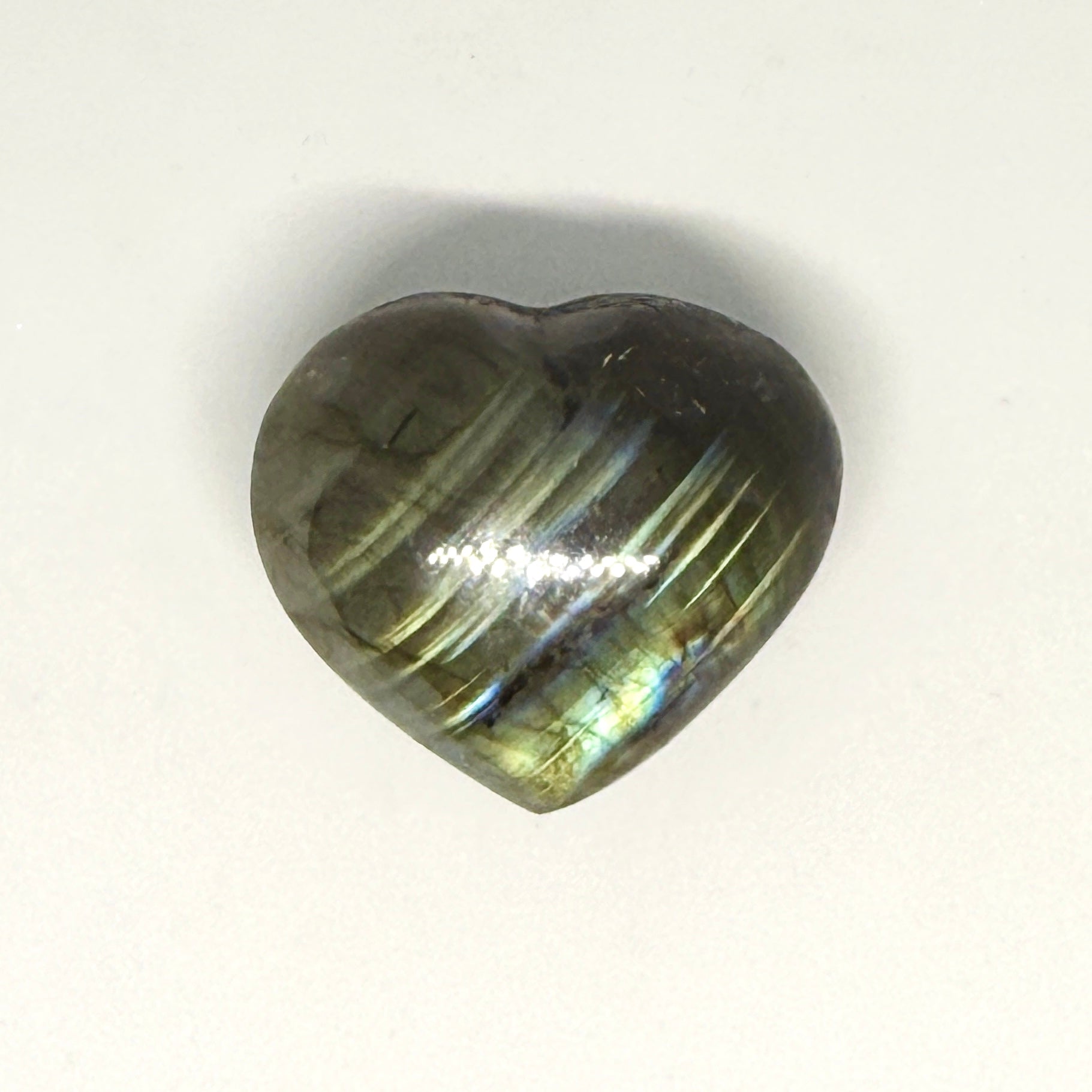 Heart-shaped crystal on a white background