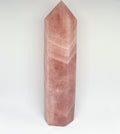 Pink crystal tower on a white background