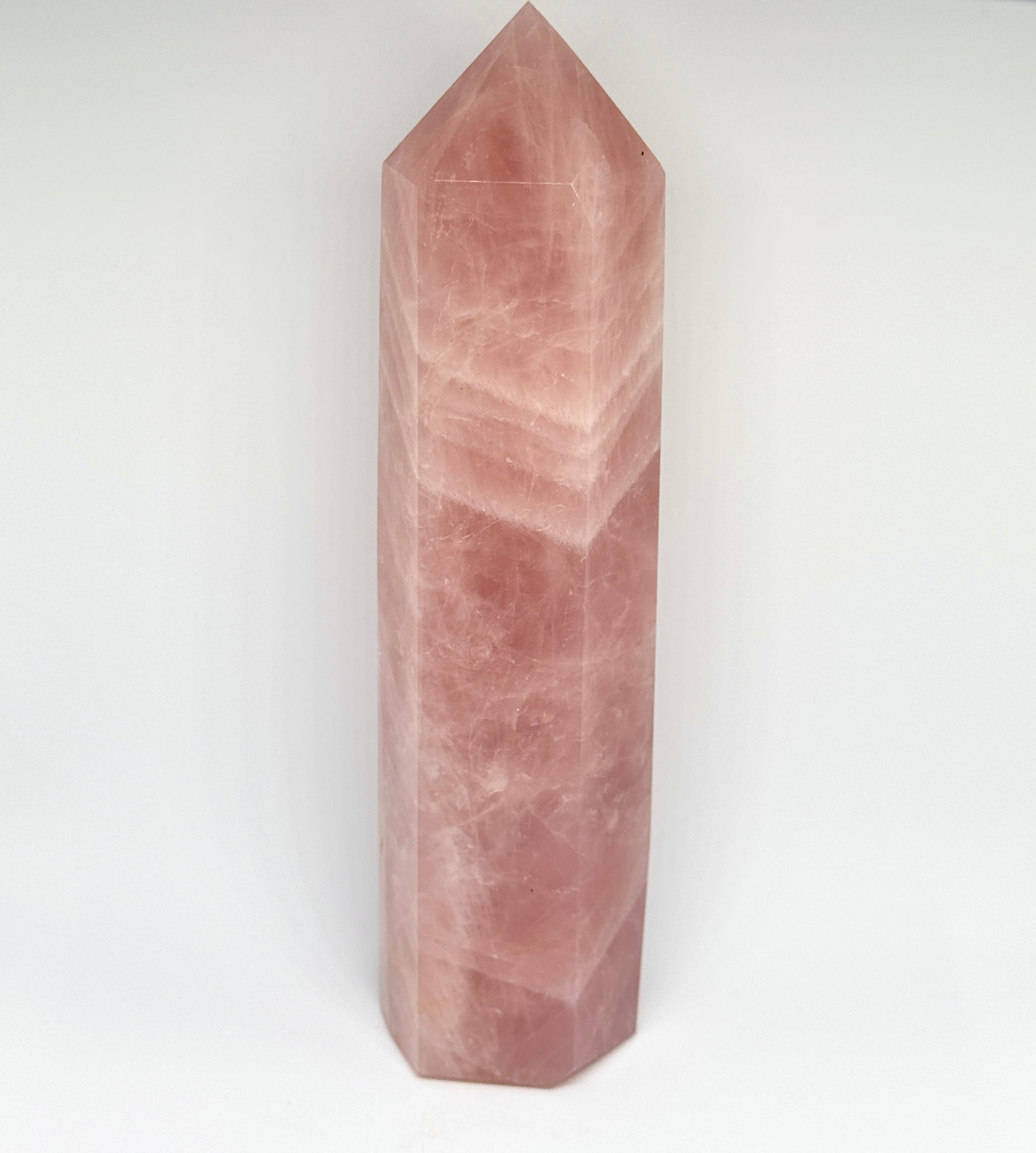 Pink crystal tower on a white background