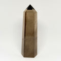 Smoky quartz crystal tower on a white background