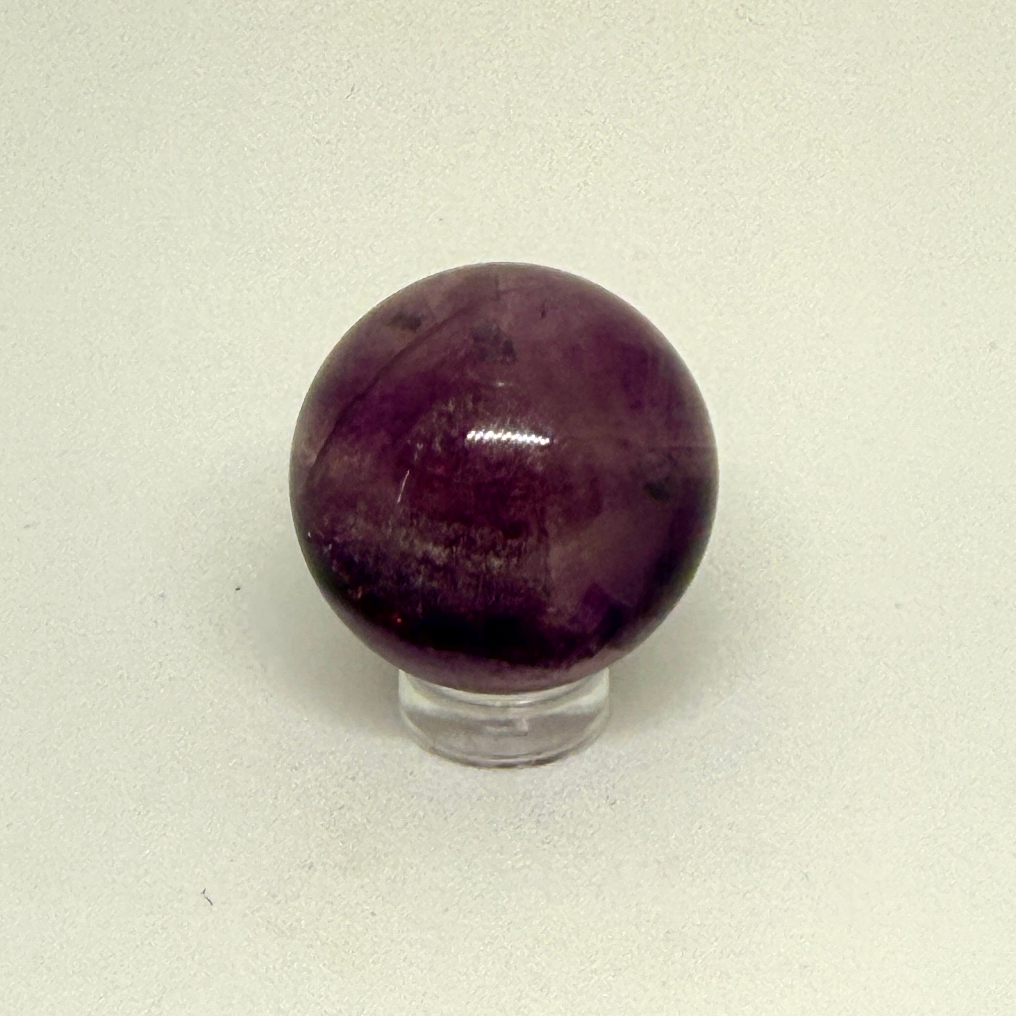 Purple crystal ball on a white background