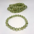 Green bead necklace on a white background