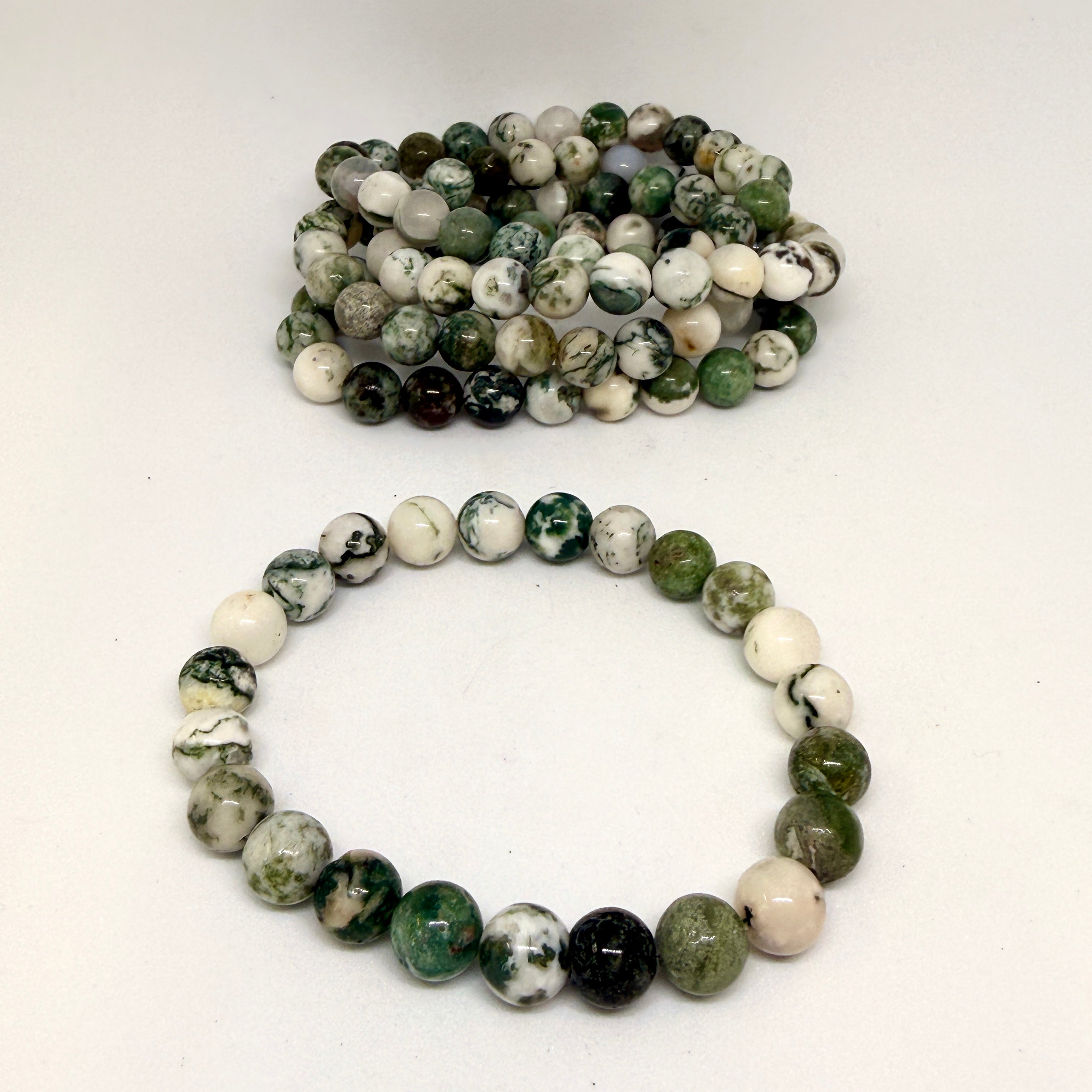 Bracelet with multicolored beads on a white background