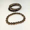 Two beaded bracelets on a white background