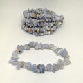 Bracelet made of small blue and white beads on a light background
