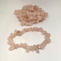 Bracelet and bracelet made of rose quartz chips on a white background