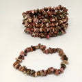 Bracelet made of multicolored stones on a white background