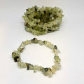 Bracelet made of green crystal chips on a white background
