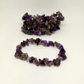 Two purple beaded bracelets on a white background