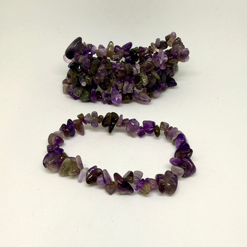 Two purple beaded bracelets on a white background