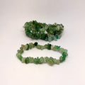 Two green bead bracelets on a white background