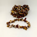 Bracelet made of multicolored stones on a white background
