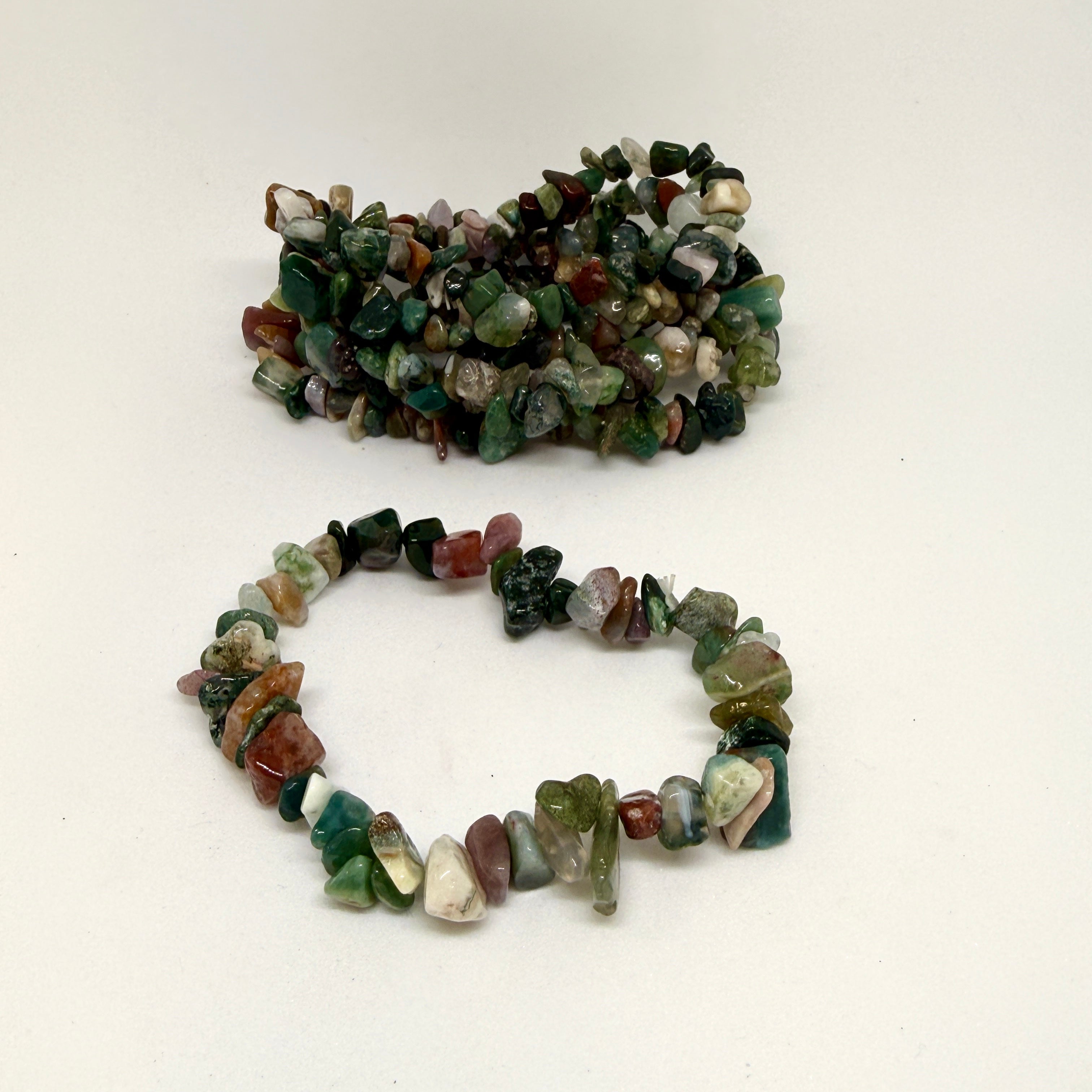 Two stone chip bracelets on a white background
