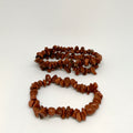 Two brown stone beaded bracelets on a white background