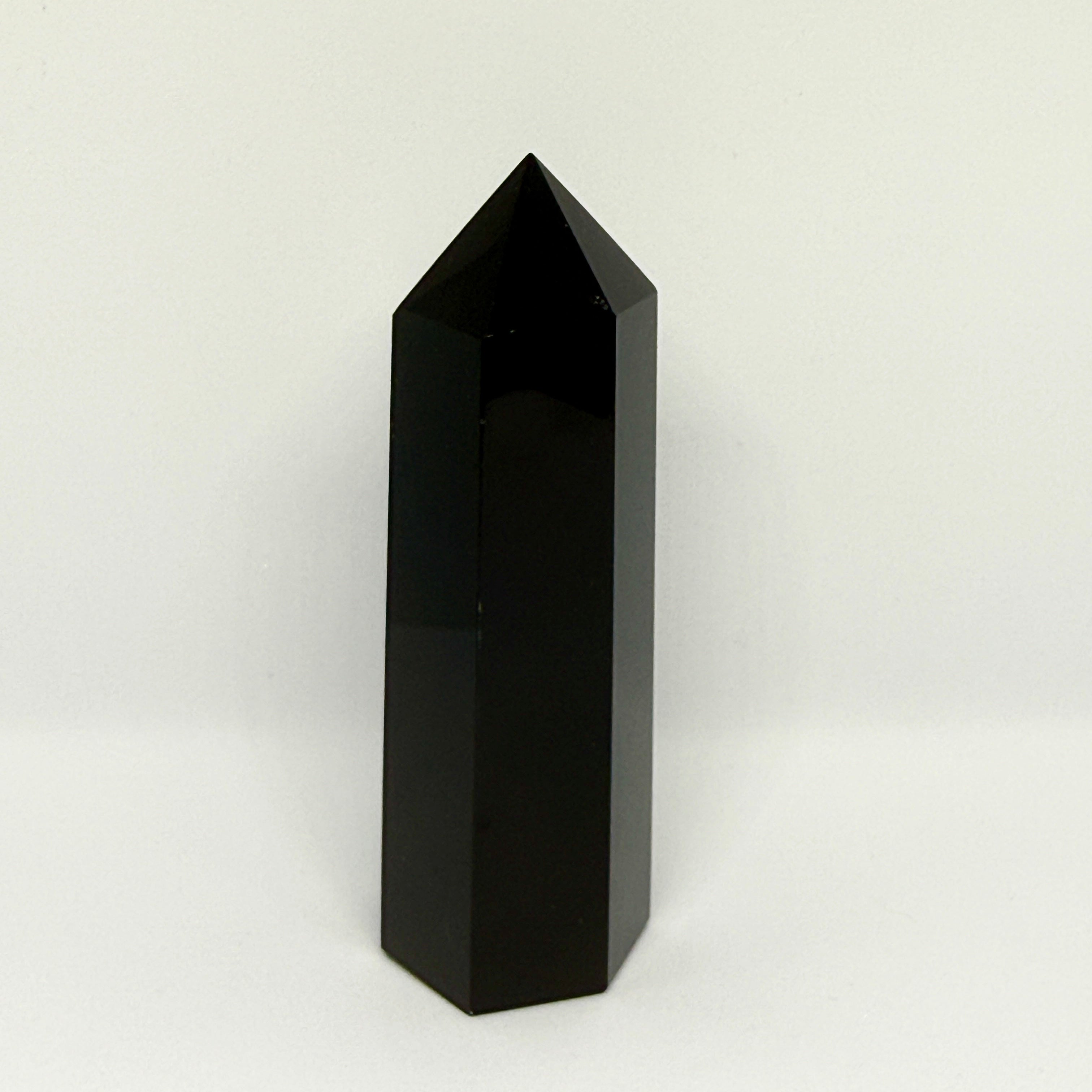 Black crystal tower on a white background