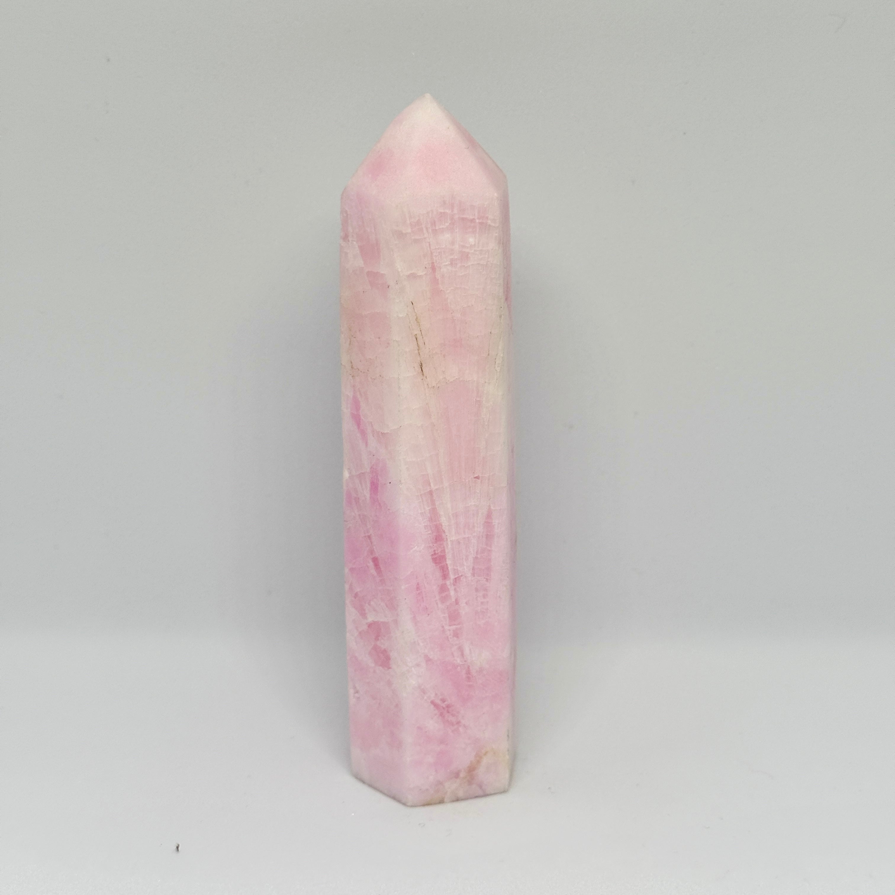 Pink crystal tower on a gray background