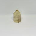 Hexagonal crystal prism on a light gray background