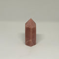 Brown crystal pyramid on a white background